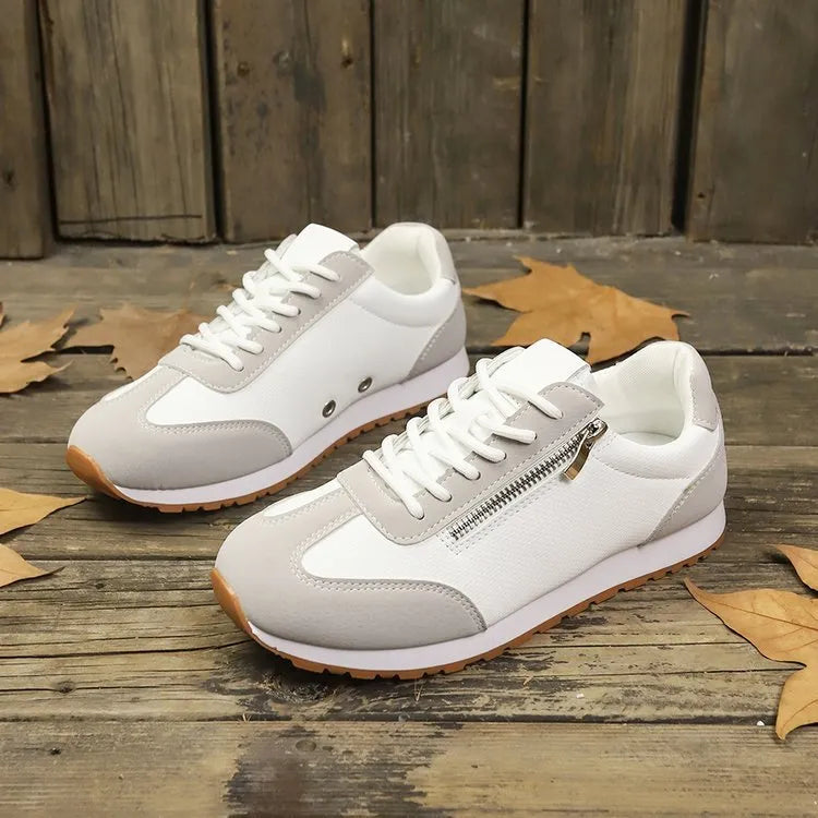 Women's flat-heeled shoes in artificial PU, available in Champagne, Gray, and White colour options.