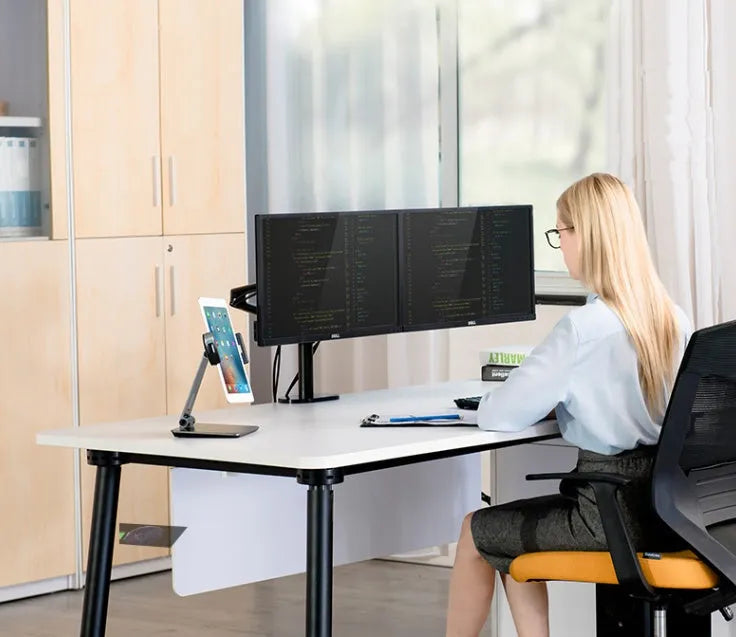 Foldable aluminium desktop phone and tablet holder in silver showing 360-degree rotation