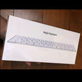 Apple Bluetooth wireless keyboard with white finish and ultra-thin metal casing