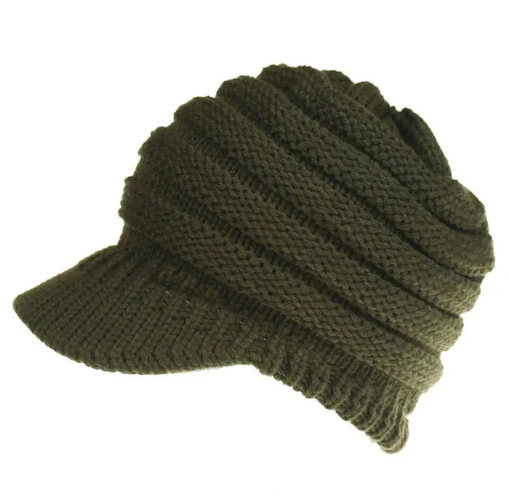 Women's soft acrylic ponytail beanie hat in various colours on a model with a ponytail.