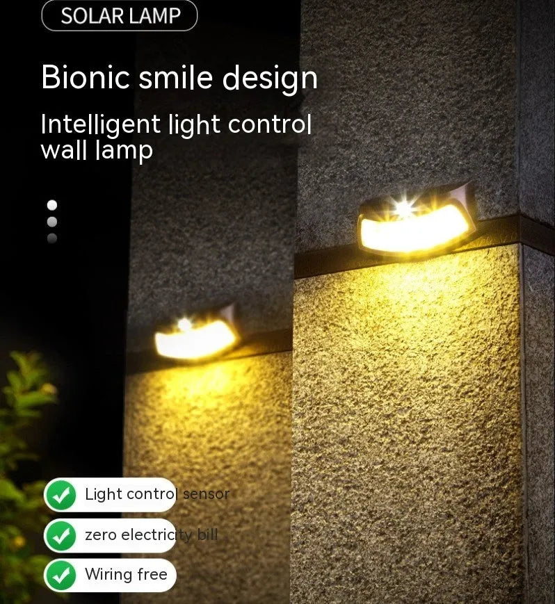 Solar outdoor wall lamp with smiling face design for garden lighting