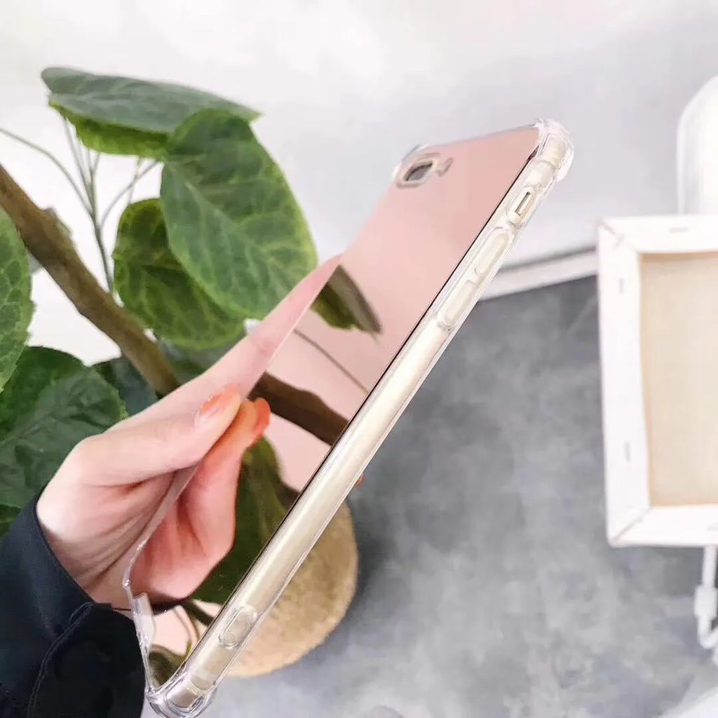 Mirror phone case for iPhone showing reflective back surface and soft TPU edges in multiple colour options.
