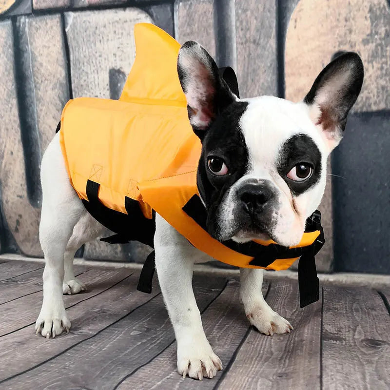Shark-shaped dog life vest in blue or orange, cloth pet life jacket with buckle, sizes XS to XXL.