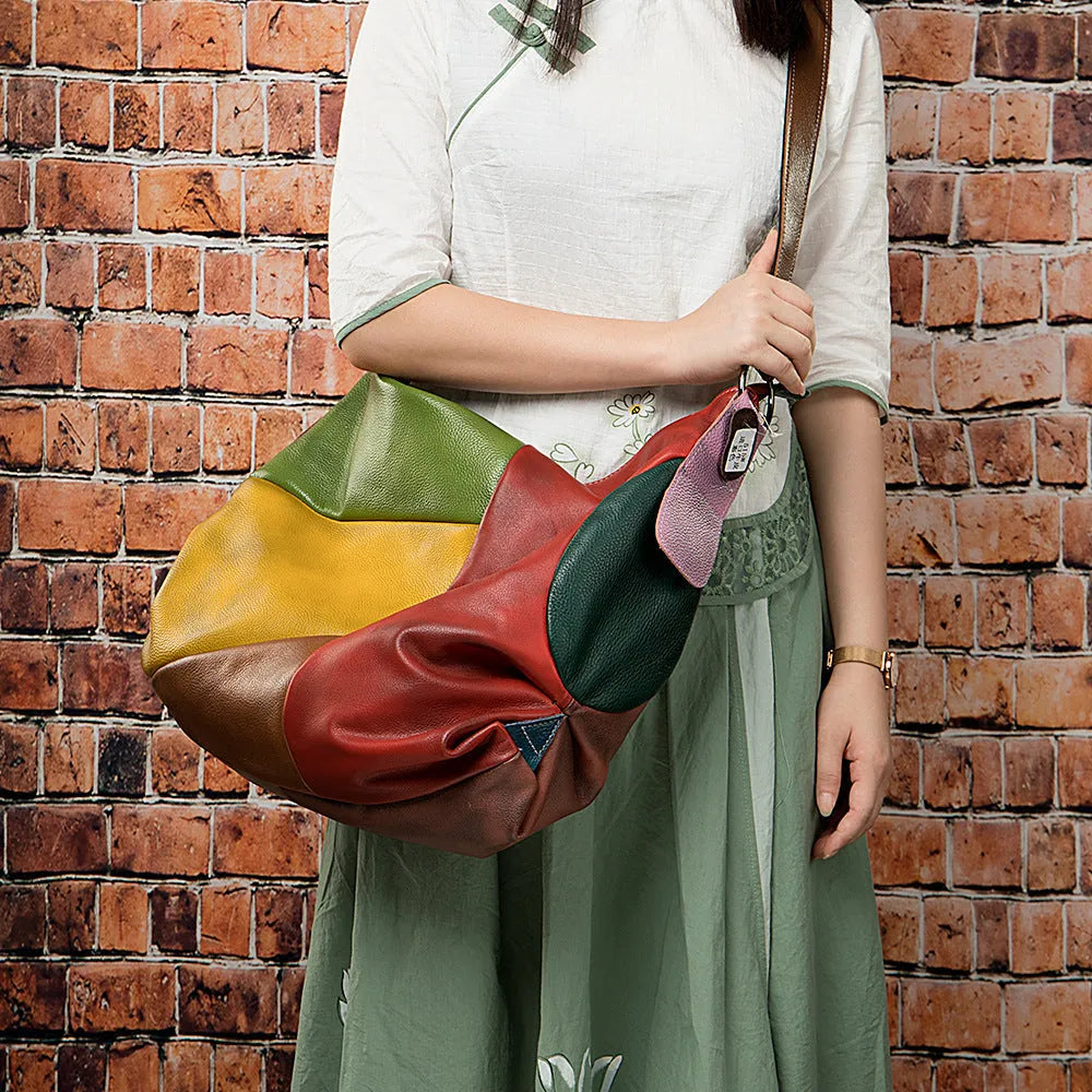Cowhide leather travel bag with stitching rubbing construction showing 48cm dimensions