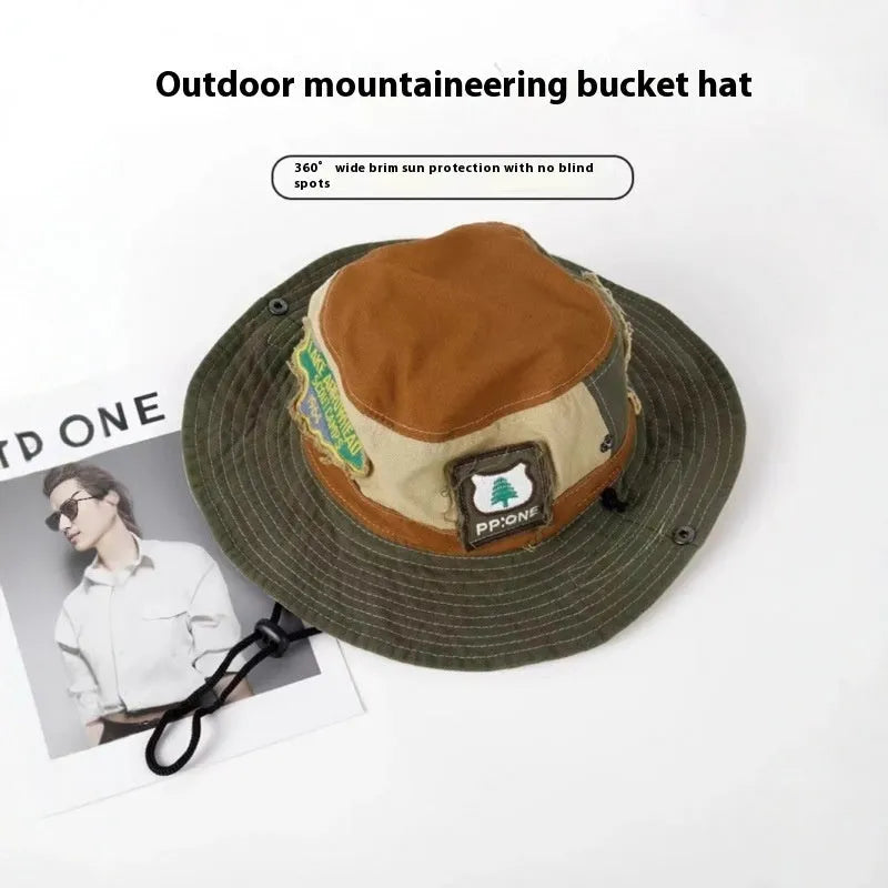 Army green cotton fisherman hat with hand-painted patchwork and flat top crown