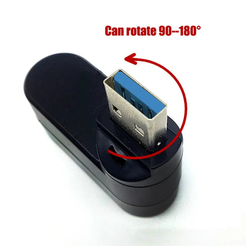 Black and white USB 3.0 hub with four ports and a rotating design on a desk.