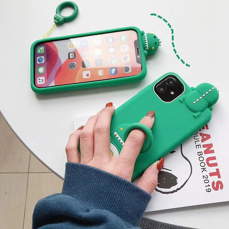 Green silicone iPhone case with cartoon animal design showing drop and water resistance features