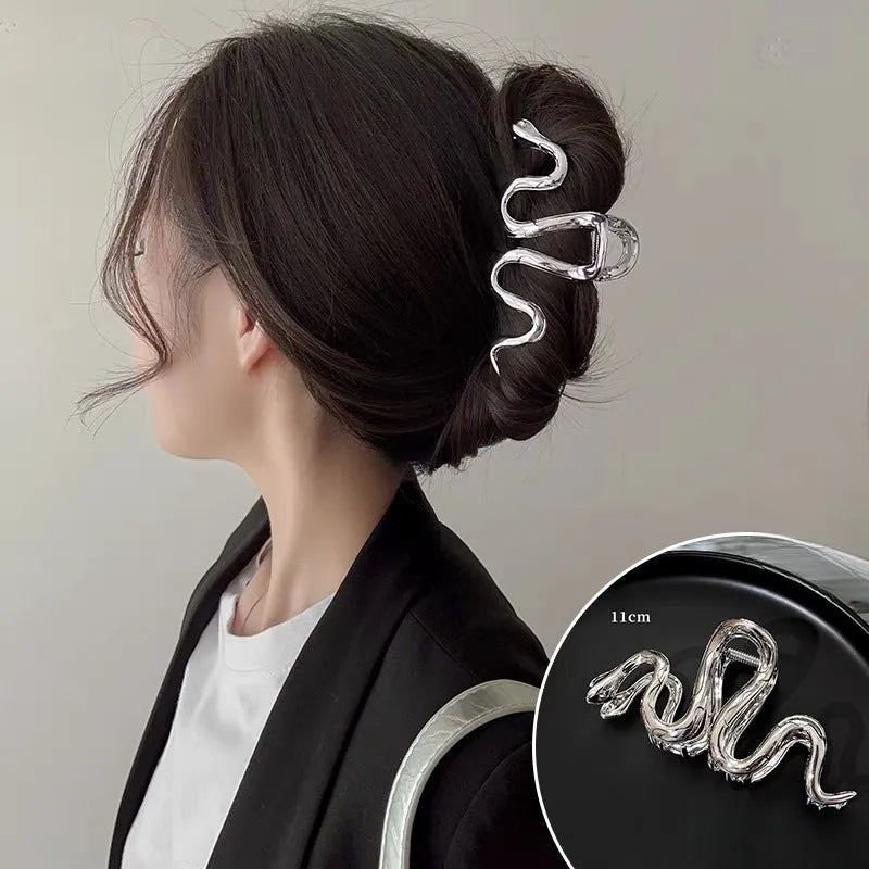 Slytherin serpentine snake design metal hair clip barrette in silver and gun black, 10.5cm long.