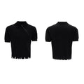 Man modelling a slim-fit black knitted polo shirt with a diagonal oblique zip and lapel collar.