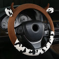 Plush car steering wheel cover with protective handle in black colour showing 38cm diameter