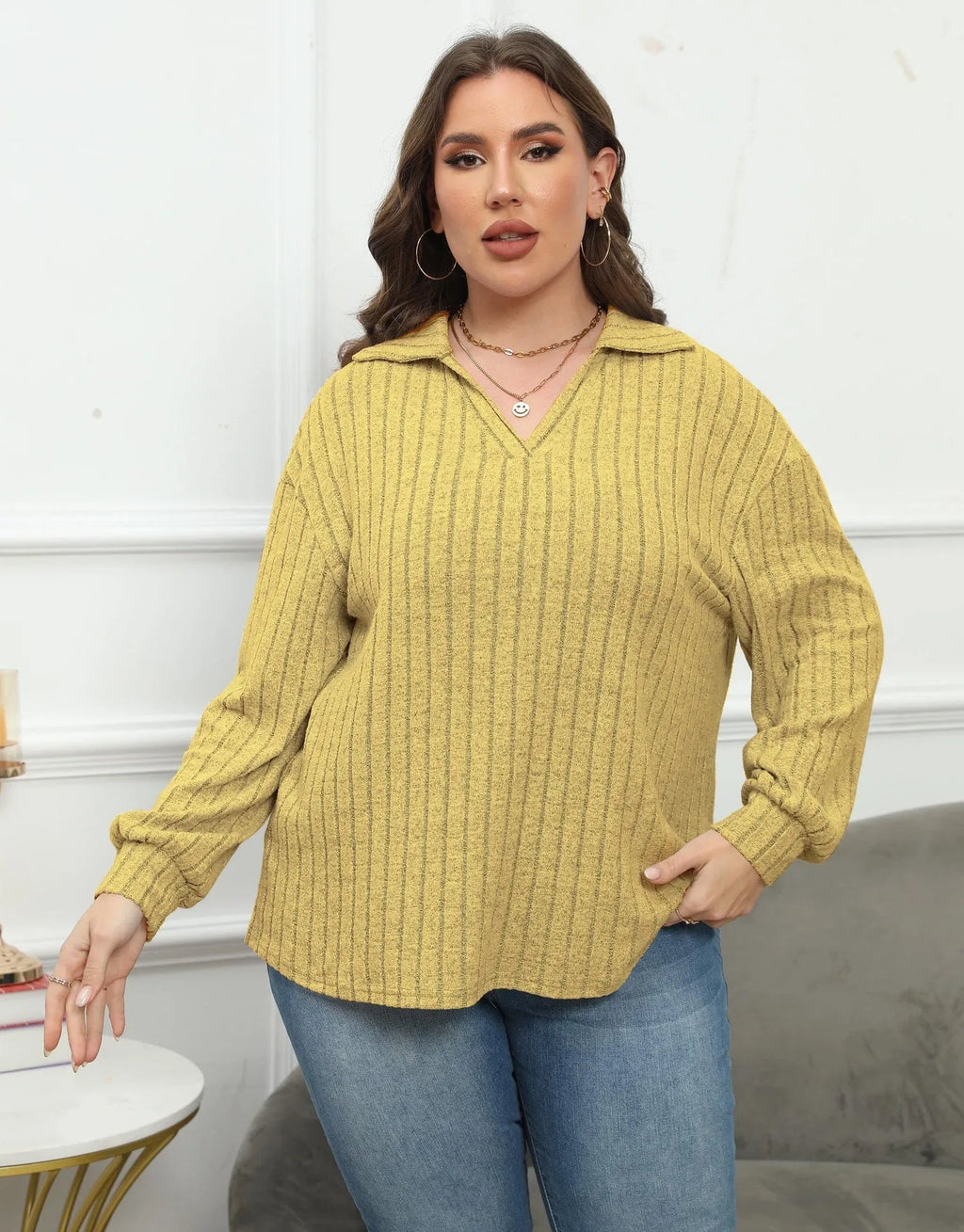 Women's plus size gray polo collar fleece shirt with lantern sleeves on a hanger.