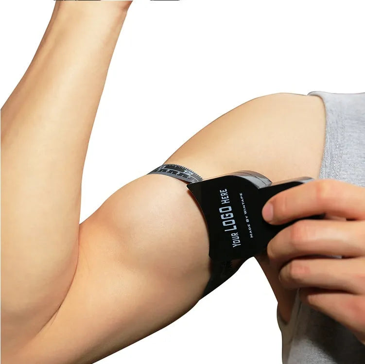 Black ABS plastic body fat measuring calliper with measurement scale and pinch mechanism