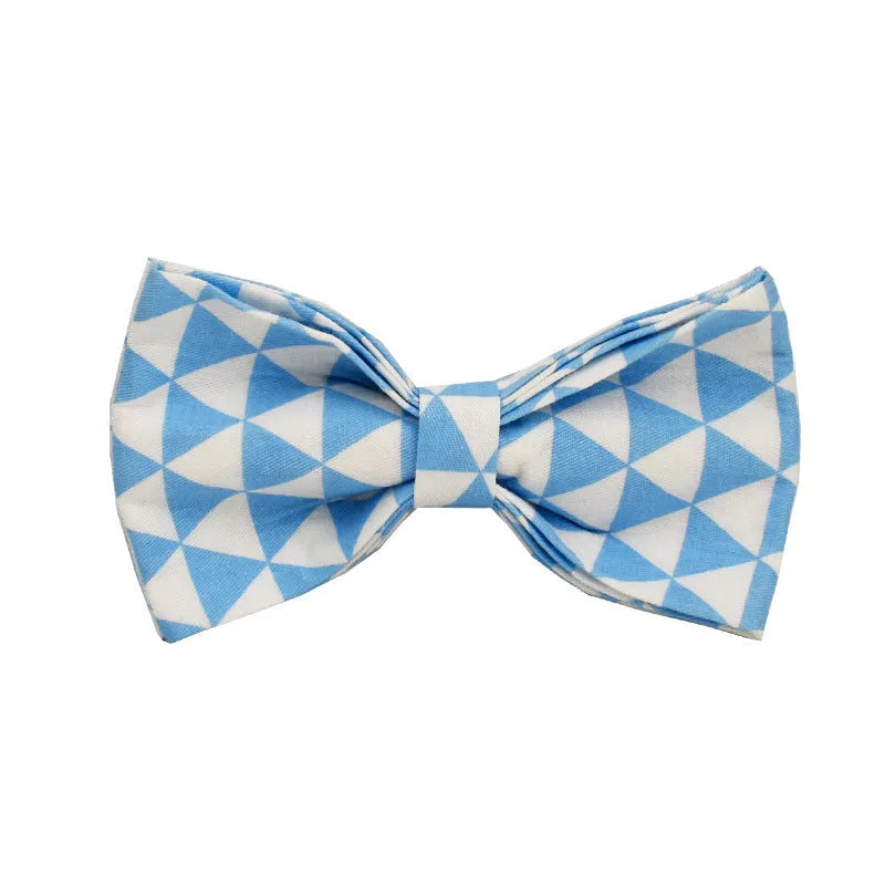 Blue cloth dog collar, leash, vest, and bow set arranged together showing all four pieces.