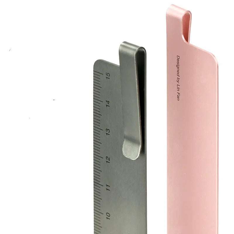 RUMA black aluminium ruler bookmark showing 15cm laser-engraved scale
