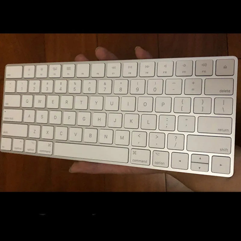 Apple Bluetooth wireless keyboard with white finish and ultra-thin metal casing
