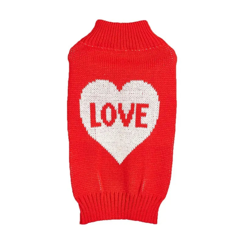 Red dog sweater with a white love heart and bow decoration on a small dog.