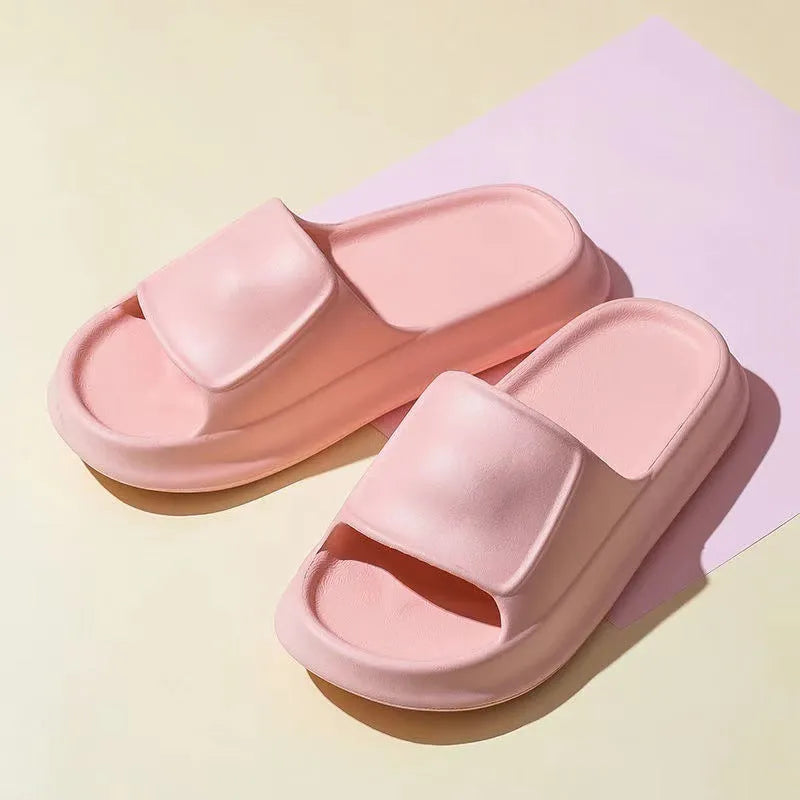 Thickened EVA non-slip flip-flop slippers in multiple colours on a bathroom floor.