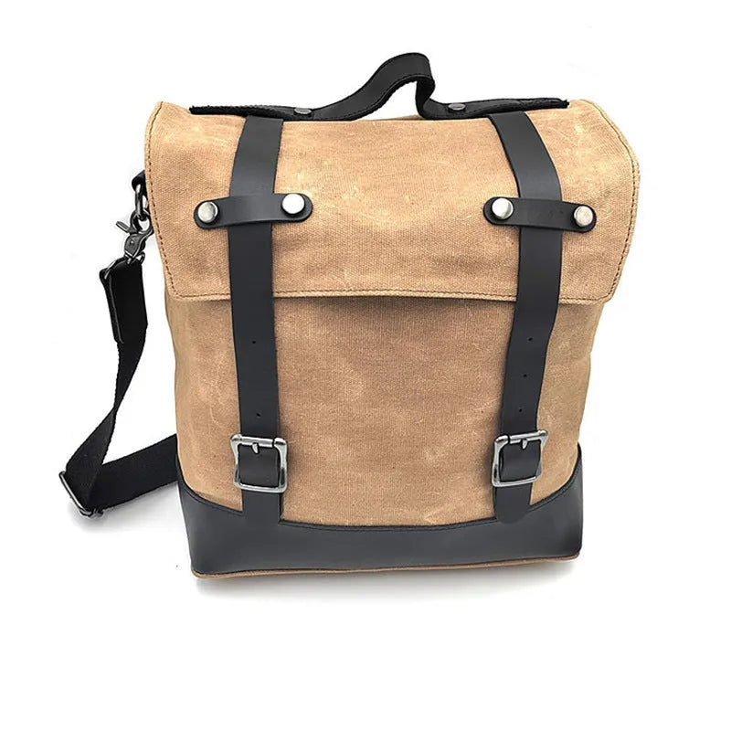 Black waterproof canvas motorcycle side bag with cowhide details mounted on motorcycle