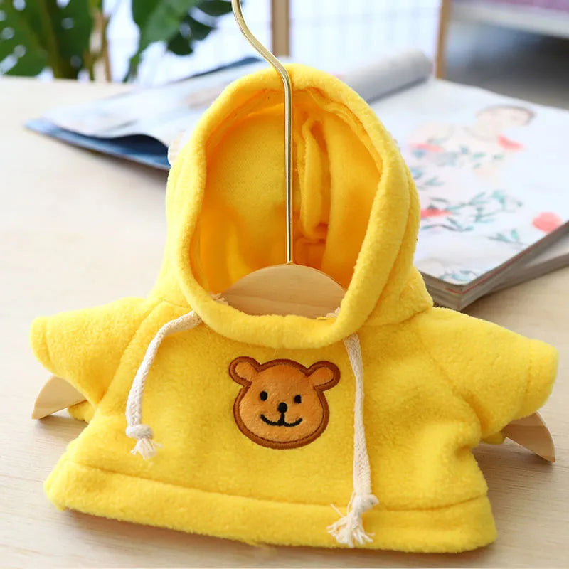 Dog wearing a cloth balaclava hoodie sweater available in blue, pink, red, yellow, brown, or grey bear design