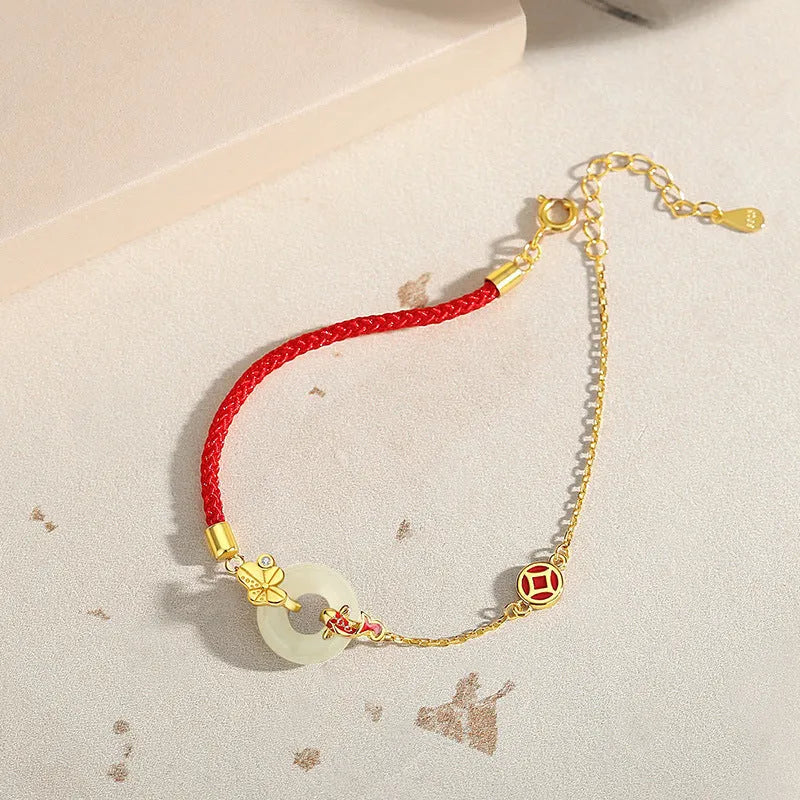 Gold electroplated Koi Peace Buckle Hetian Jade Red Rope Bracelet with safety clasp and animal zodiac design
