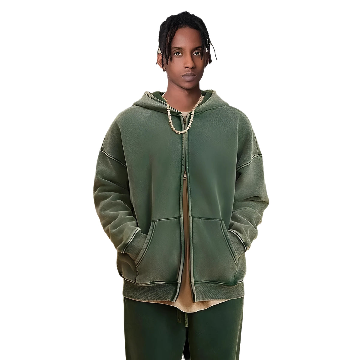 Man wearing a dark green fleece-lined hooded cardigan sweater with a double zipper.