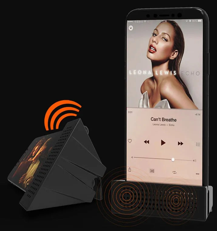 A portable black ABS mobile phone amplifier bracket holding an iPhone to boost sound for desktop use.