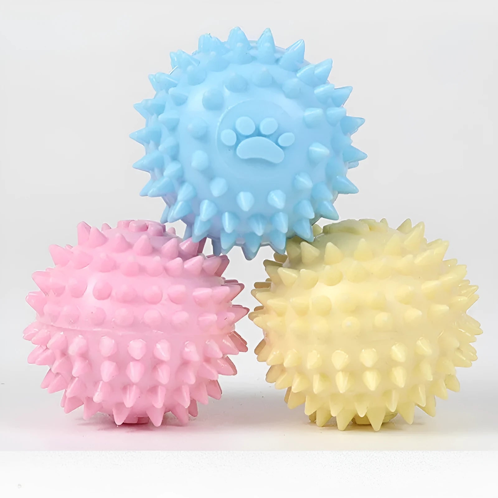 Blue TPR rubber dog chew ball with textured surface for tooth cleaning, 6cm diameter.
