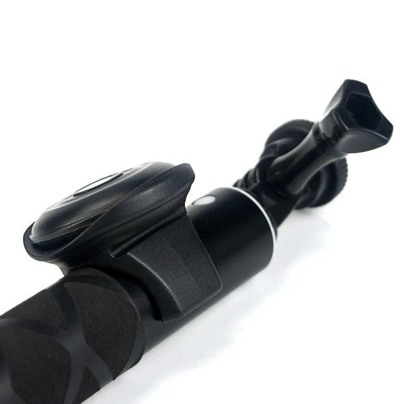 Small black Bluetooth remote control for wireless smartphone camera shutter release.