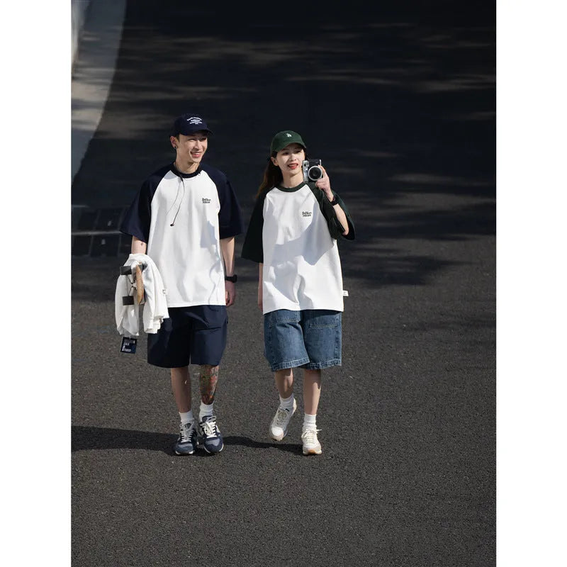 Blue Japanese-style loose men's t-shirt with raglan sleeves on a hanger