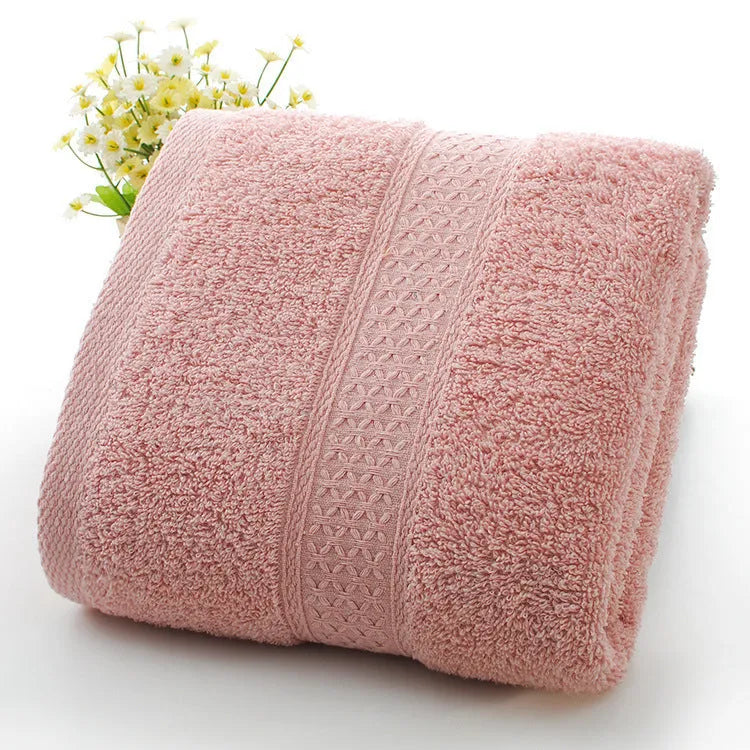 Thickened cotton blend bath and beach towel shown in multiple colour options including green, blue, and pink variations.