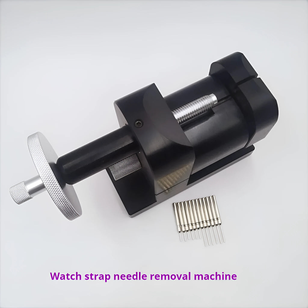 Steel alloy watch strap removal tool with spring mechanism on a work surface