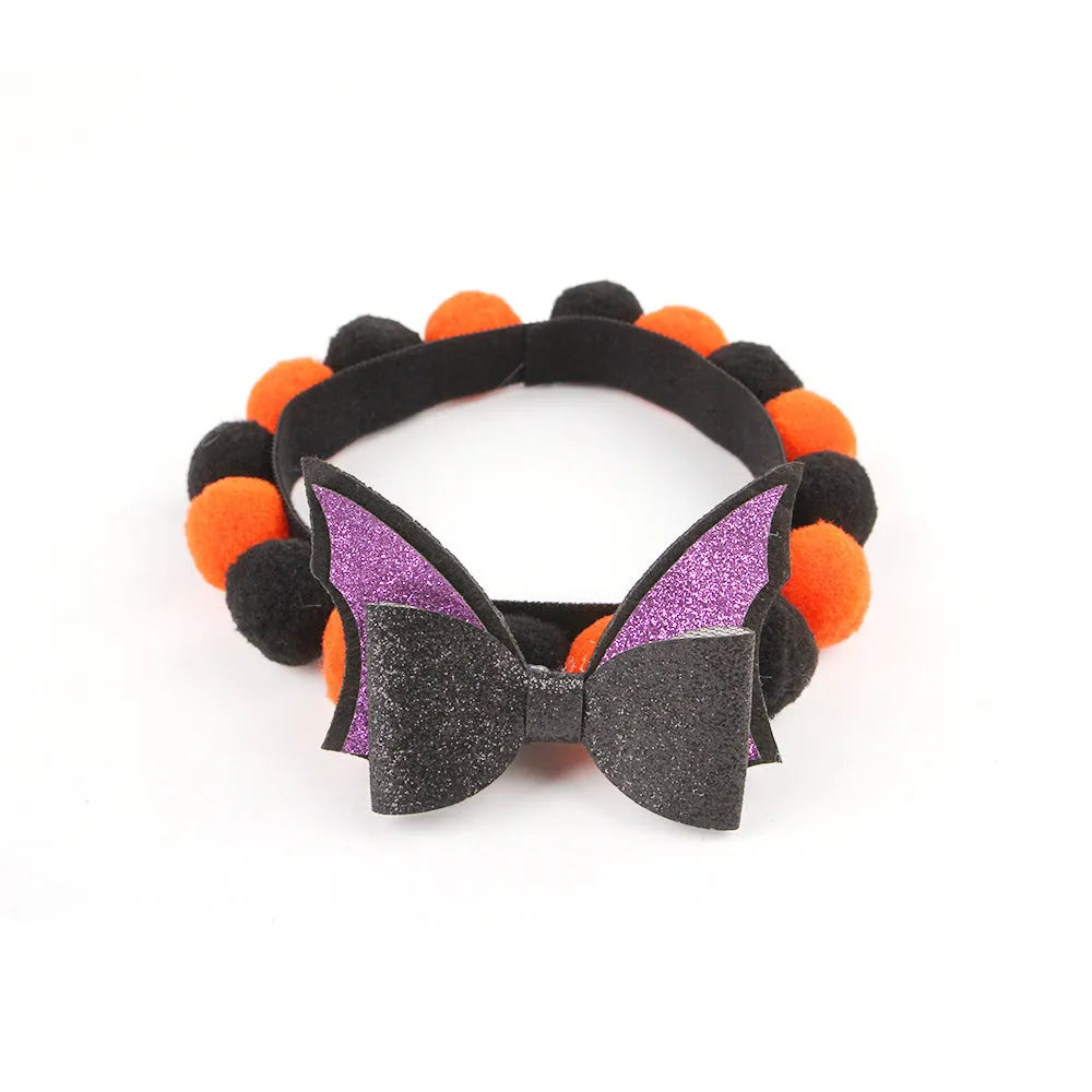 Halloween pet collar with fur ball decoration in pumpkin, skull, witch, and bow designs.