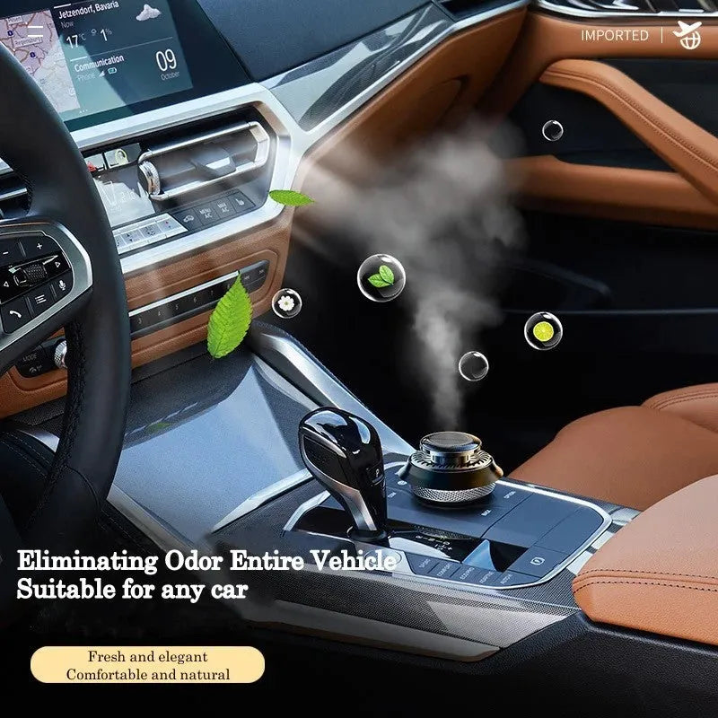 Solar powered kinetic car air freshener with rotating double rings on a black plastic base.