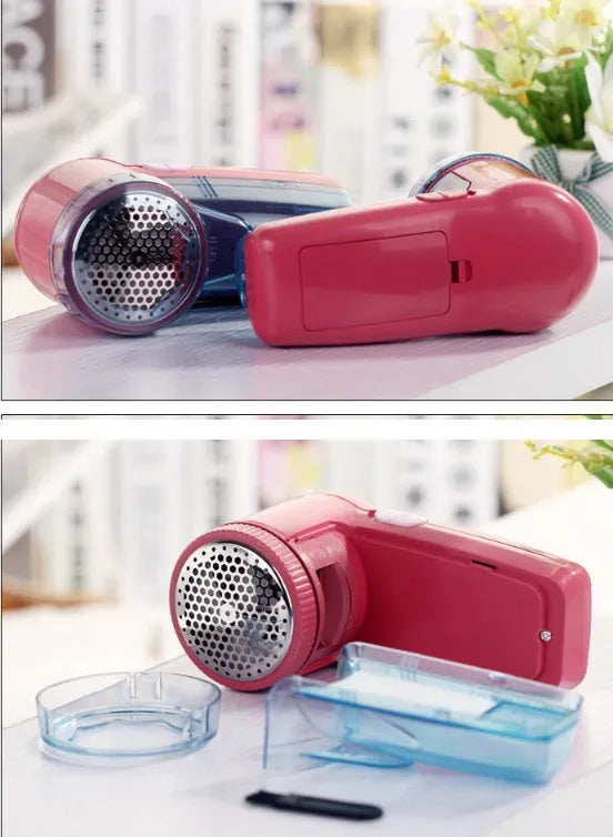 Portable electric clothing lint remover shaver in hand, showing compact size and shaving head.