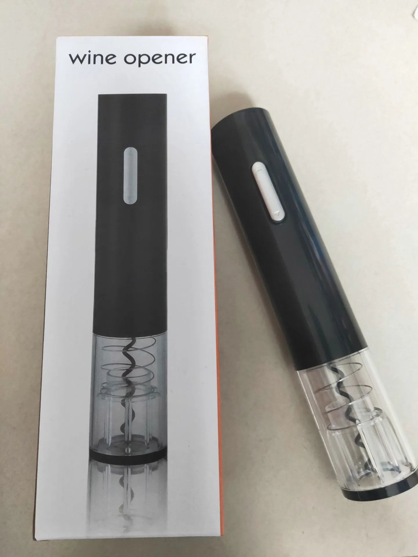 Black automatic electric wine opener kit with foil cutter and transparent body section