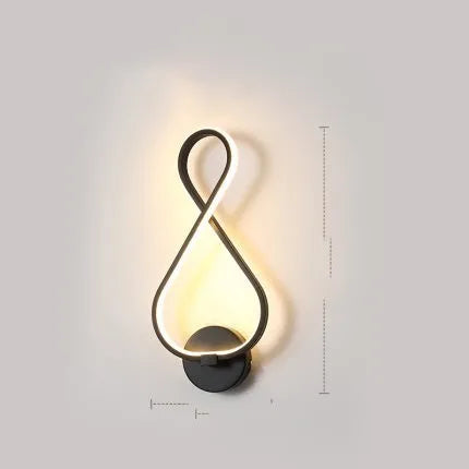 LED wall lamp with silicone shade in black or white finish showing button switch control