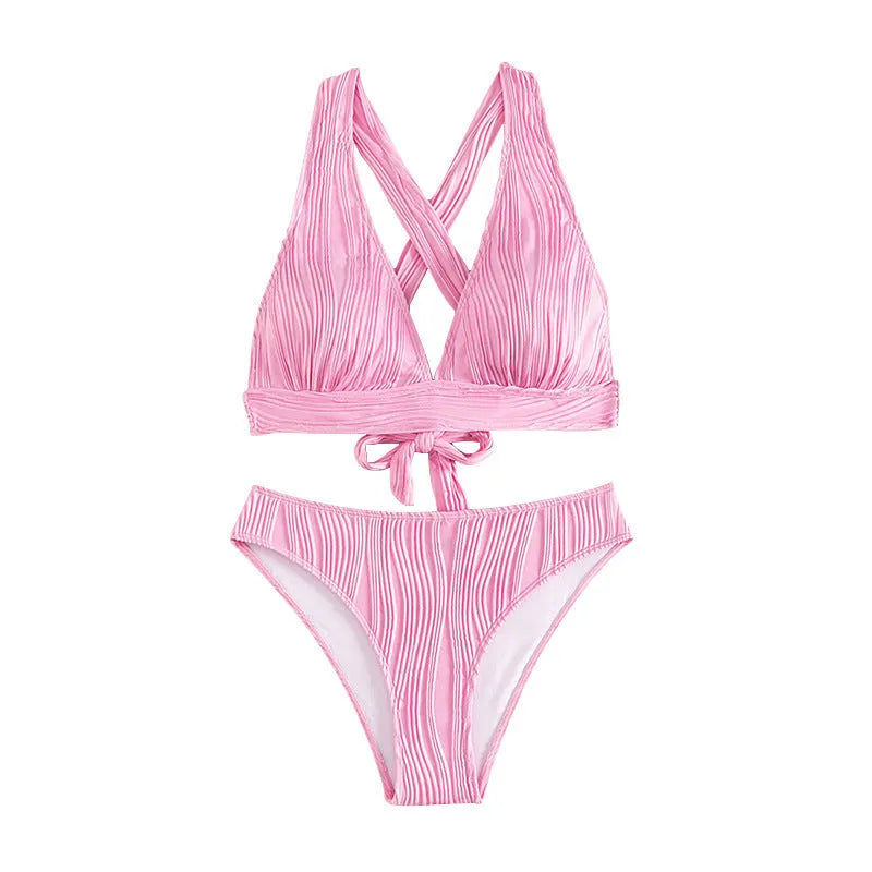 Women's black and pink halter neck bikini set with matching shorts on a mannequin.