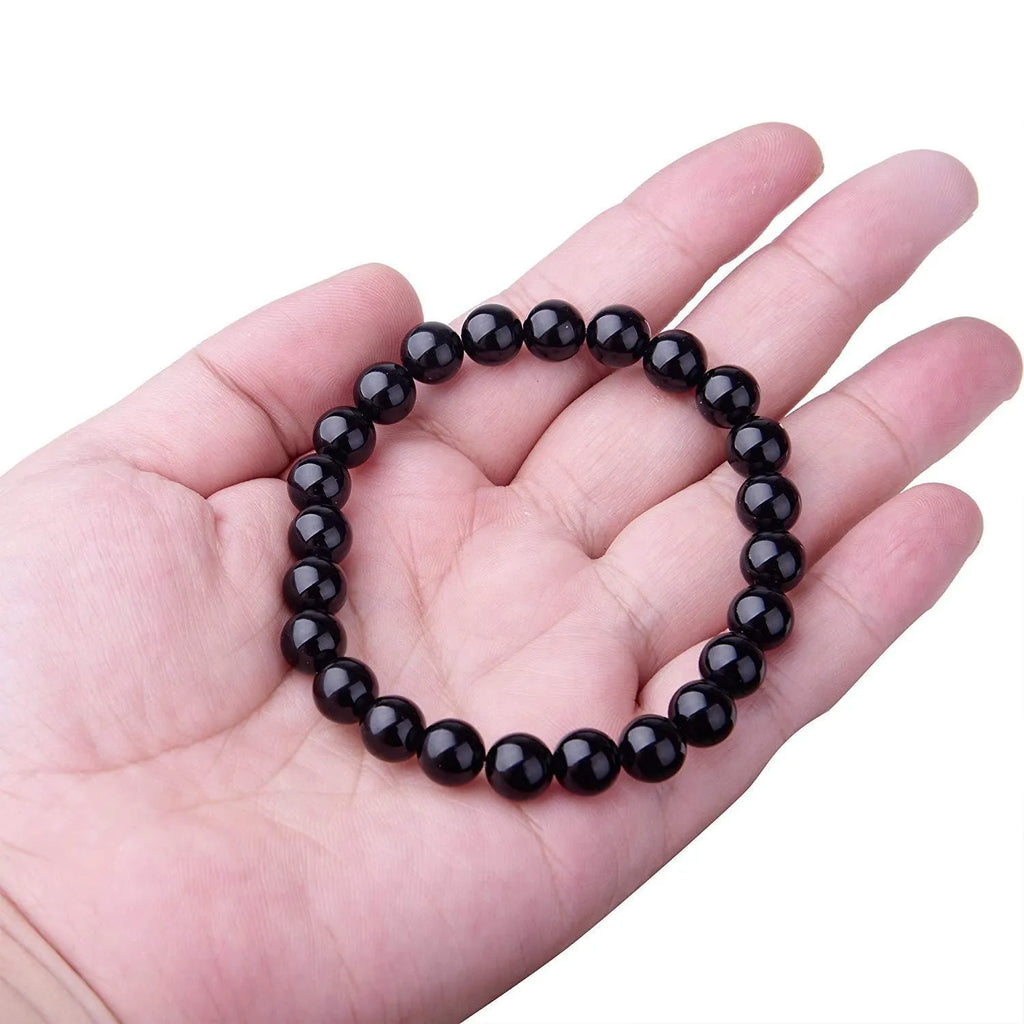 Black onyx geometric bracelet with 8mm beads on a stretchy elastic cord.