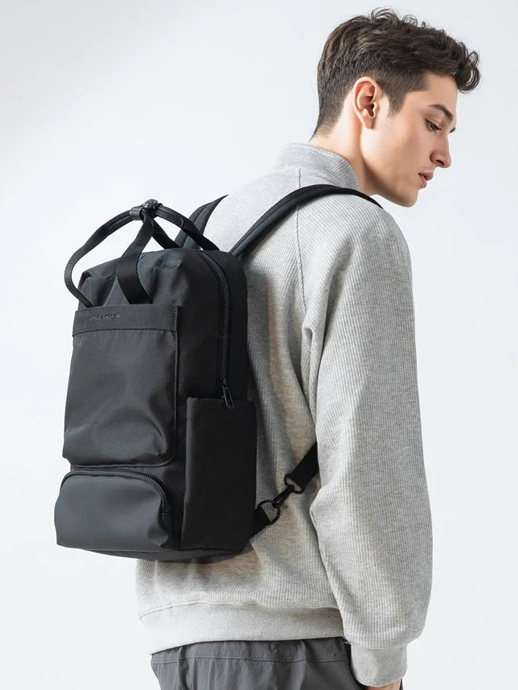 Elegant Black Oxford cloth computer backpack with a 20-35 litre capacity and polyester lining.