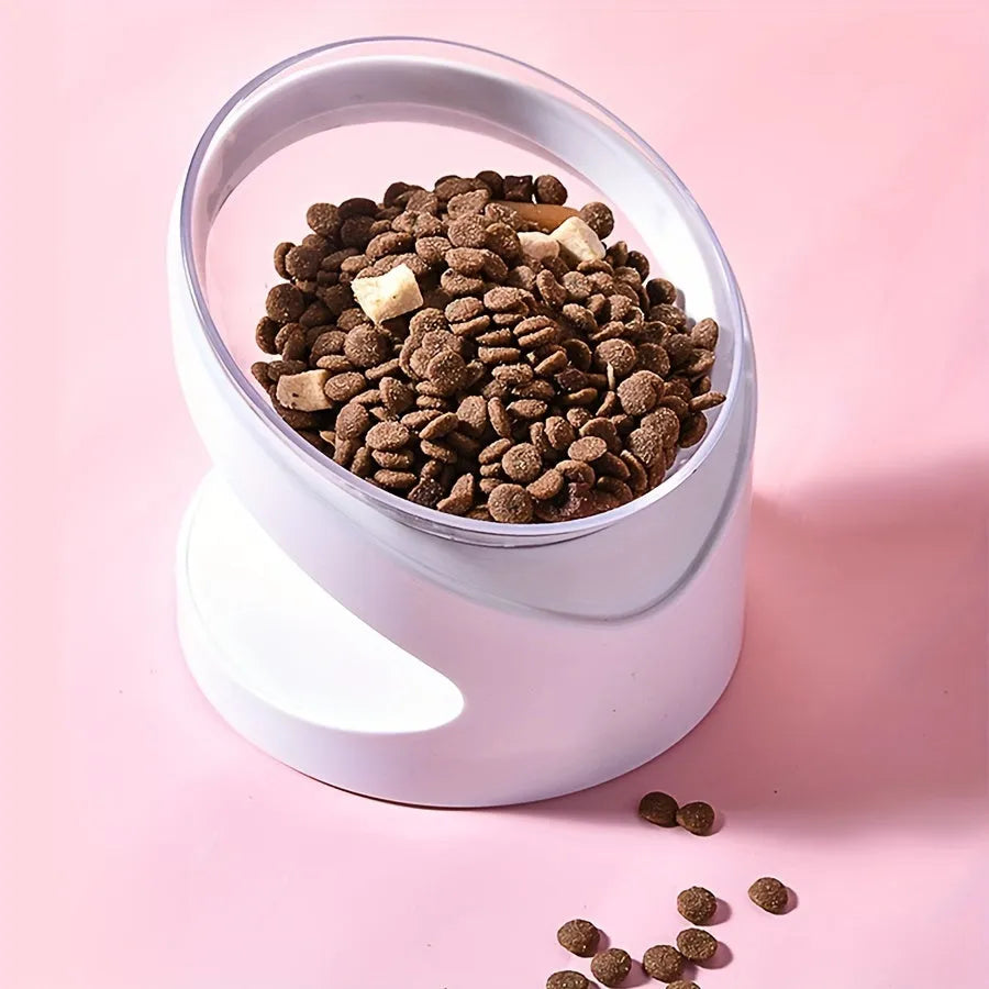 Clear plastic tilted cat food bowl for ergonomic feeding and neck protection