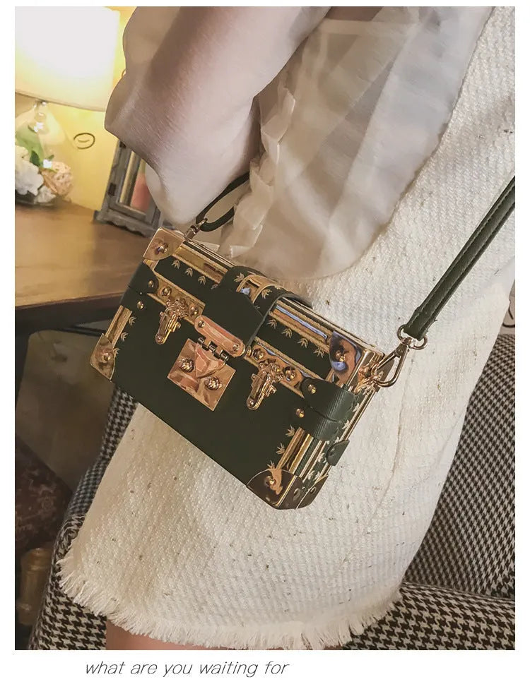 Women's black hard PU leather shoulder bag with single strap and decorative rivet detailing
