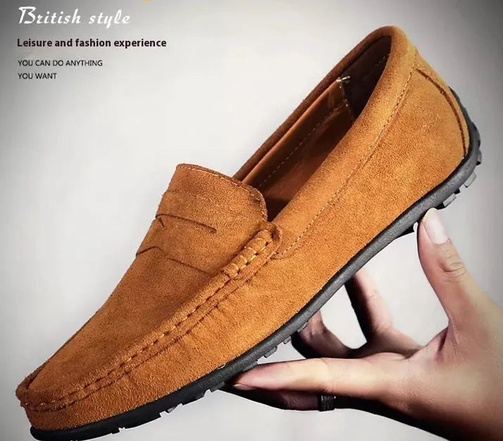 Men's brown suede Gommino casual shoes with round toe and flat rubber sole on a white background
