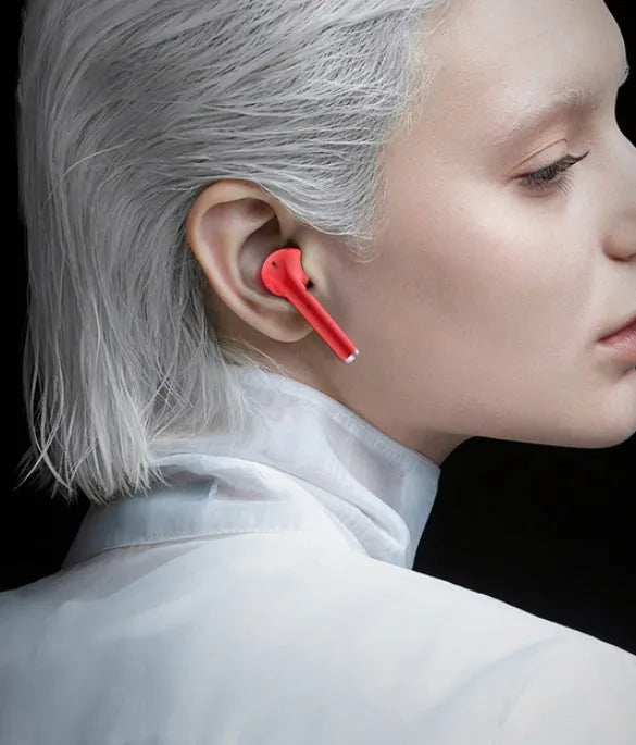 Lipstick-shaped Bluetooth earphone in black, pink, purple or white with curved earbuds and compact charging case