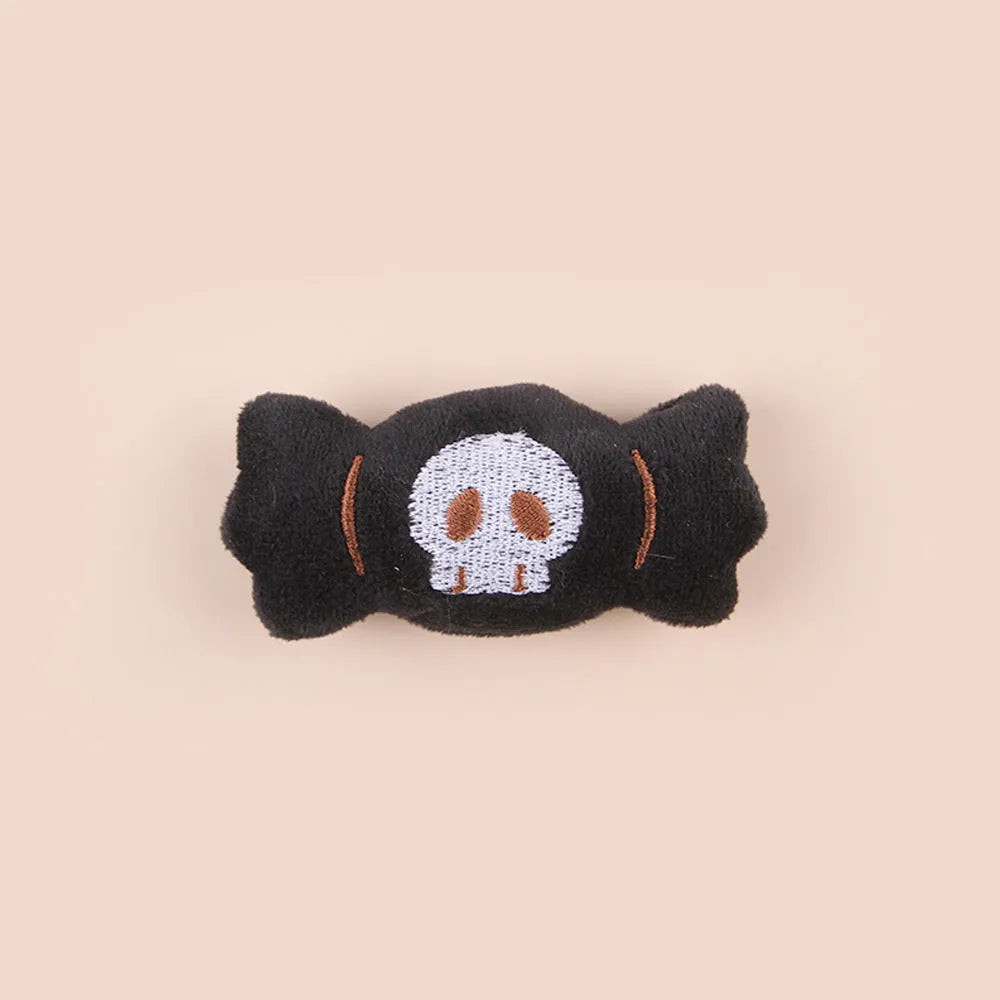 Small cat teaser wand with candy, eyes and skull plush attachments