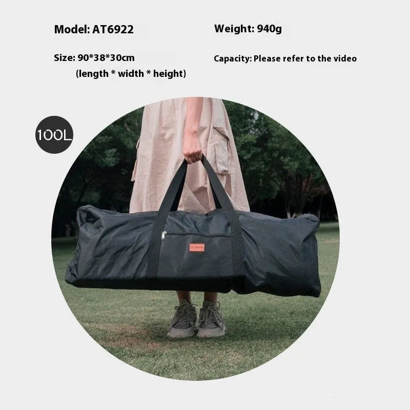 Large black waterproof storage bag with carrying handles, shown next to a folded camping chair.