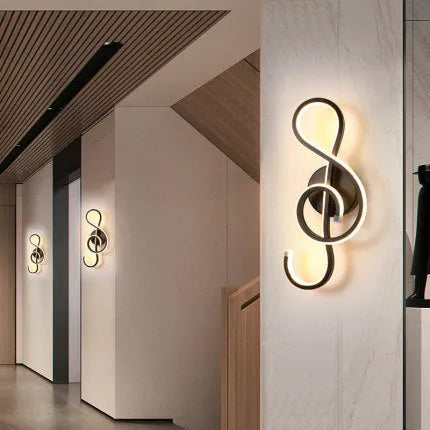 LED wall lamp with silicone shade in black or white finish showing button switch control