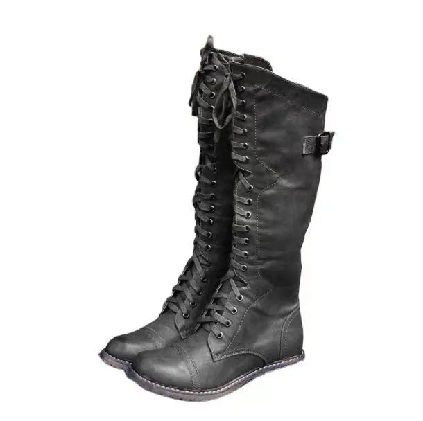 Women's black chunky low heel high leg ankle boots made from artificial PU leather.