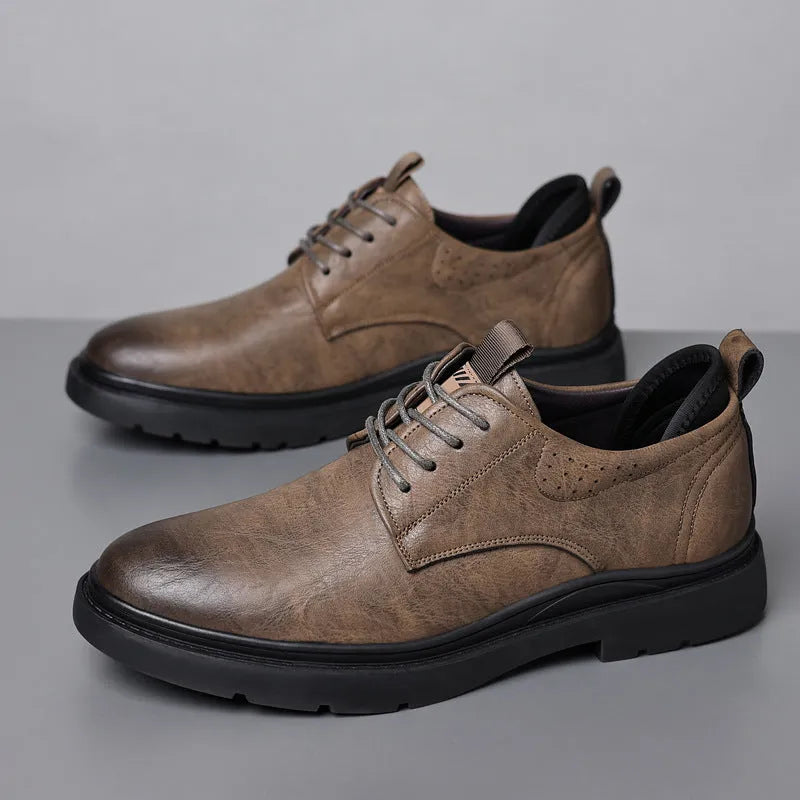 Men's black leather casual sneakers with sewing line detailing and rubber soles