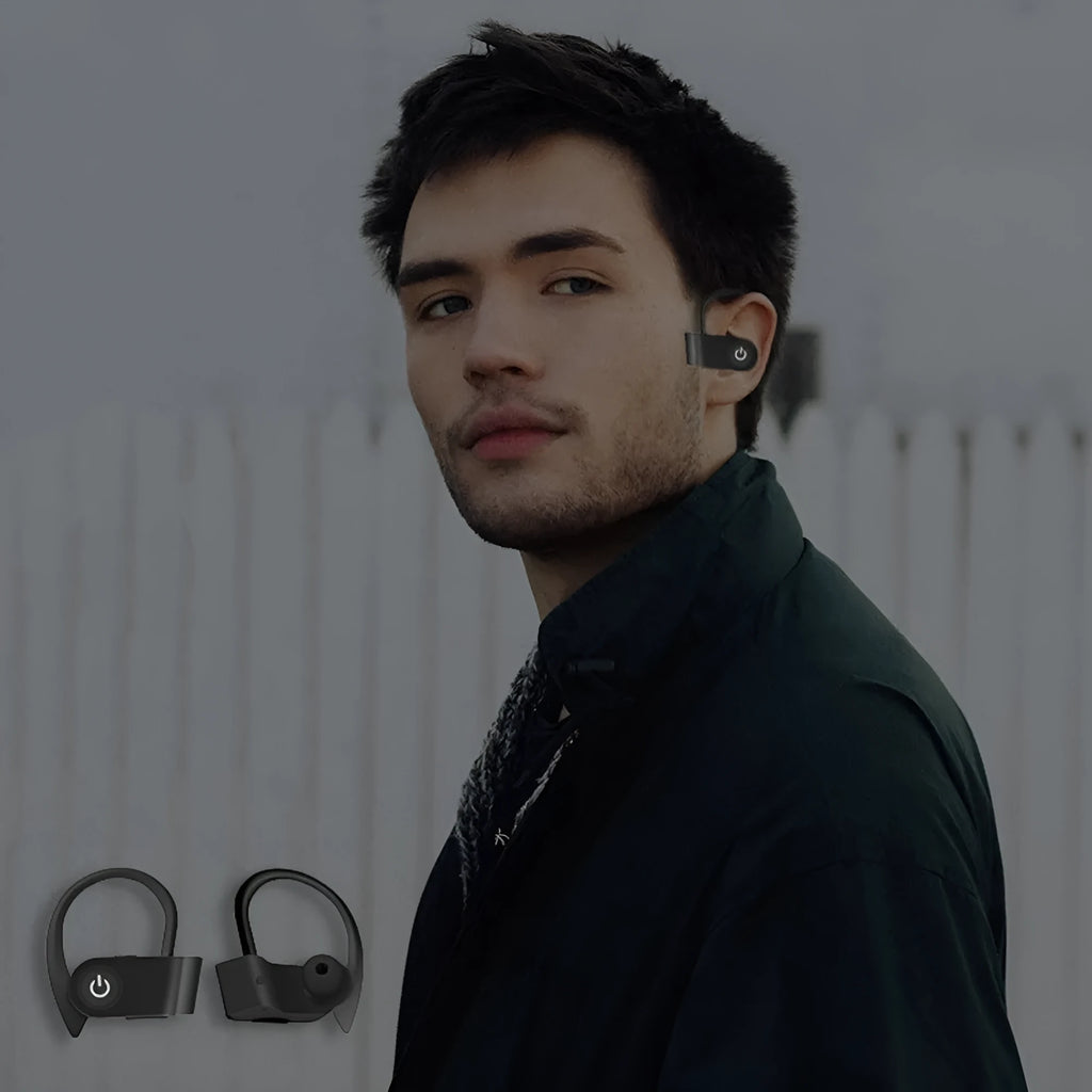 Black wireless Bluetooth earphones with an ergonomic design shown on a grey background.