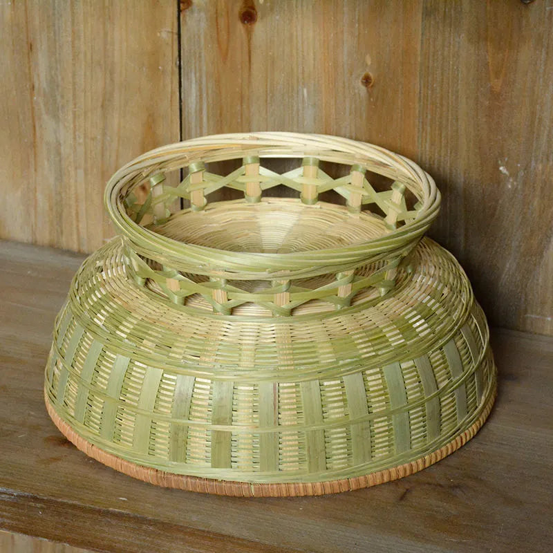 Handmade woven natural bamboo storage basket shown in one of three size options.